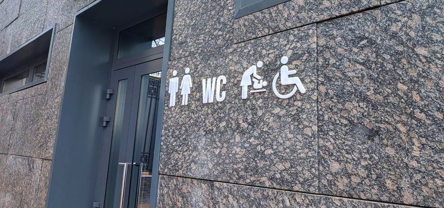 Universal accessibility symbol ISO 7001 made of black acrylic, person in wheelchair sign. 3D, modern, minimalist, restaurant, hotel door sign - self-adhesive